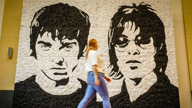 Oasis mural made of bucket hats unveiled ahead of gigs